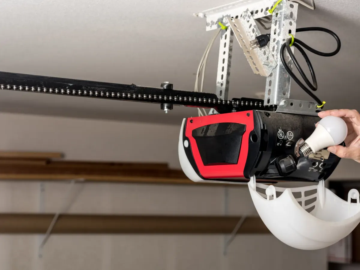 Technician servicing a garage door opener