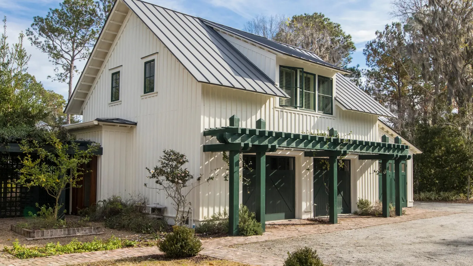 Modern home exterior at dusk with a residential garage door