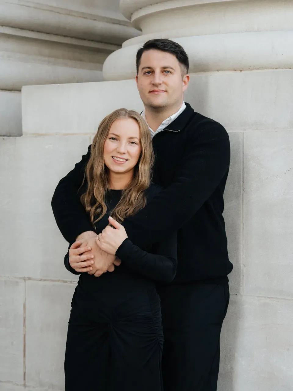 NK Garage Doors team photo in front of a garage