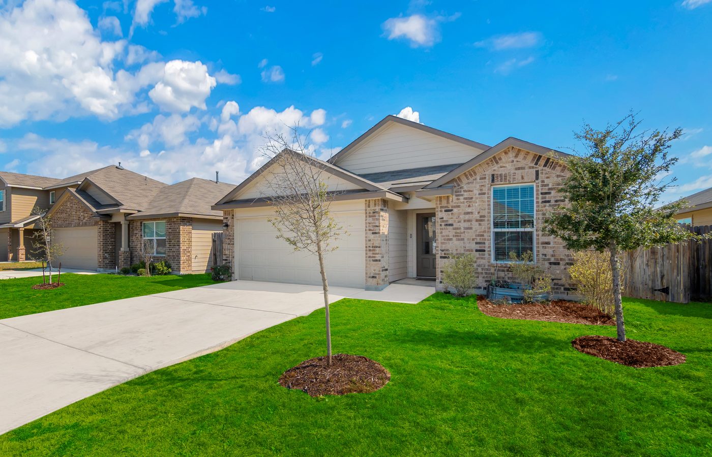 Freshly installed insulated double garage doors on a modern home in Knoxville