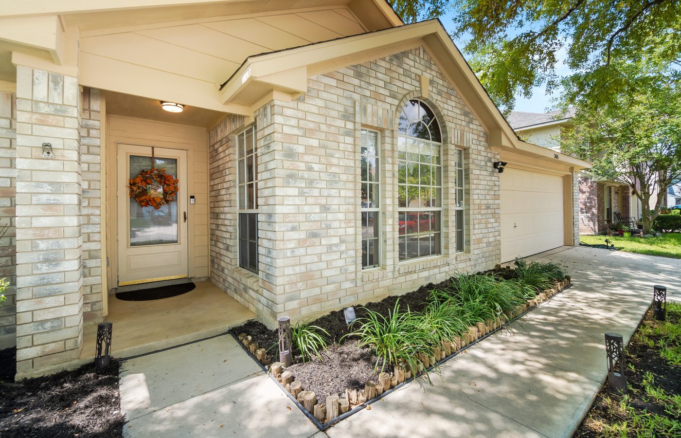 Freshly installed insulated double garage doors on a modern home in Knoxville