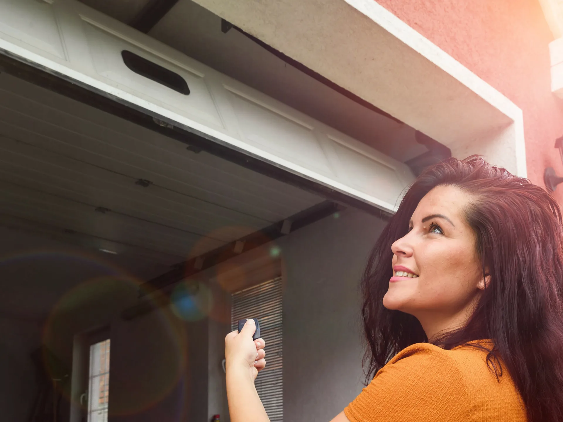 Happy customer with a garage door service professional